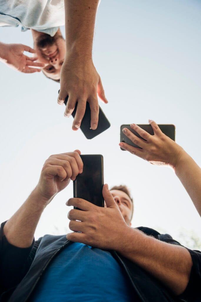 a man and his friend holding phone